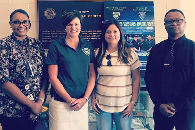Pictured are: JCCC Warden Doris Falkenrath, DOC Director Anne Precythe, MOSERS Executive Director Abby Spieler, and Deputy Warden Billy Dunbar.